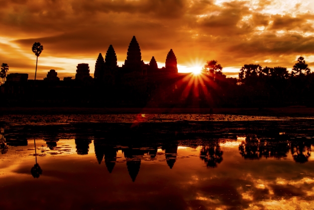 Angkor Wat with the sun rising behind it