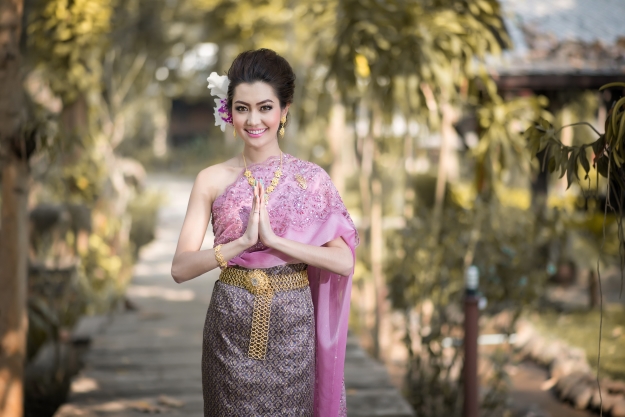 Asian woman performing a wai