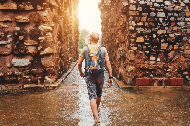 Traveller walking after rain