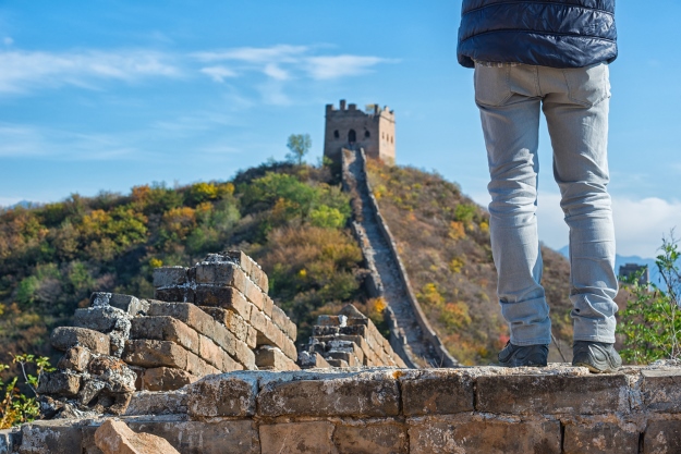 Traveller standing on the Great Wall of China.