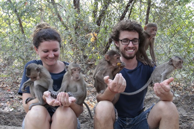 Couple with monkeys at Phnom Tamao