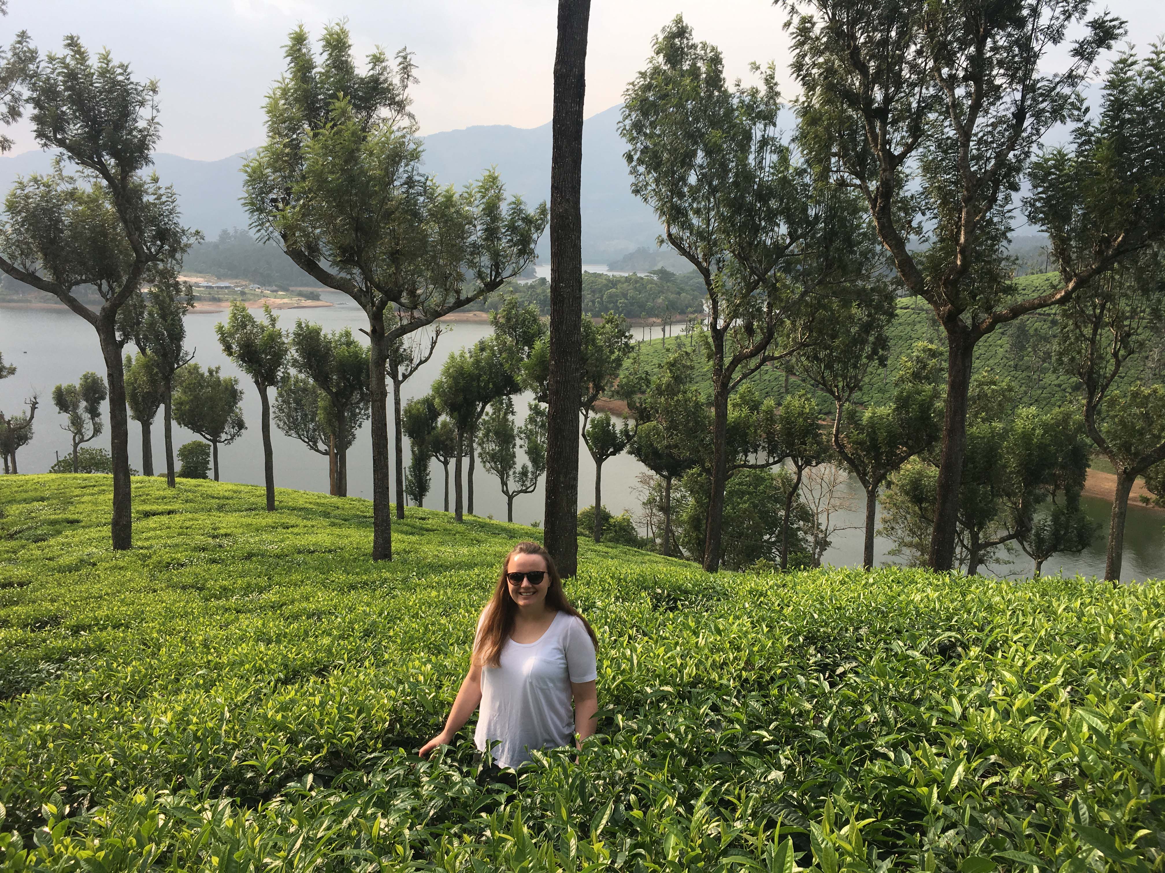 Chloe standing in the tea plantation