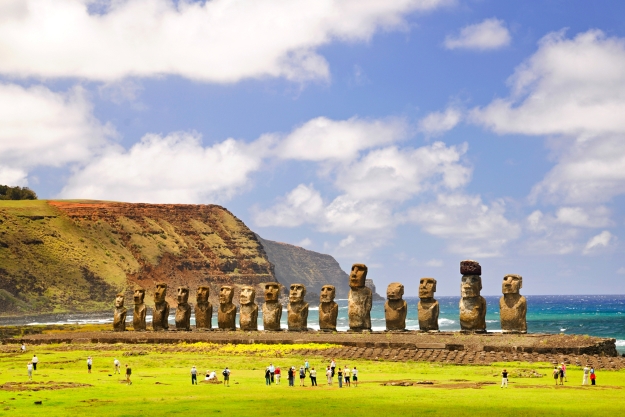 People admiring the stone moai of Easter Island