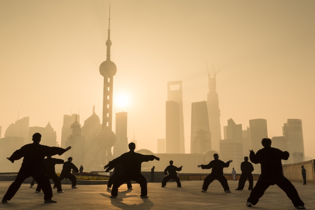 Locals practicing Tai Chi in Shanghai at sunrise