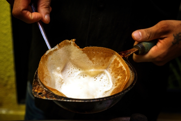 A fresh hopper being cooked in a pan