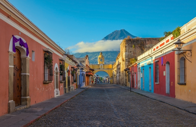 Views of a street in Antigua looking towards the Pacaya Volcano