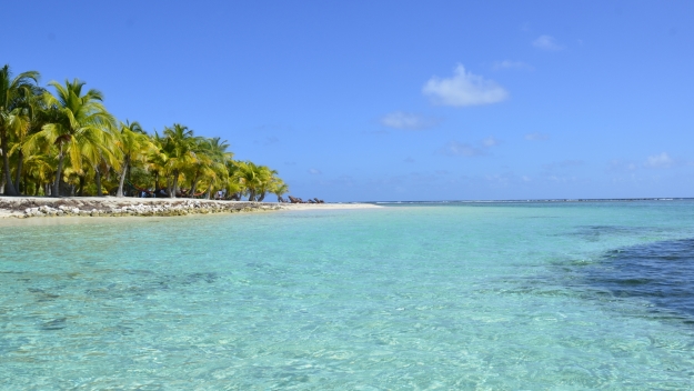 View of a small desert island in a tropical sea