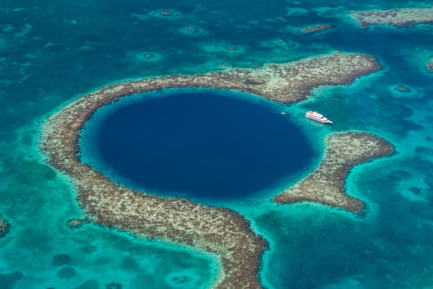 The Great Blue Hole just off the coast of Belize from above.