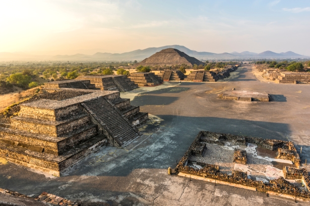 Views of Teotihuacan Aztec ruins at sunrise from above.