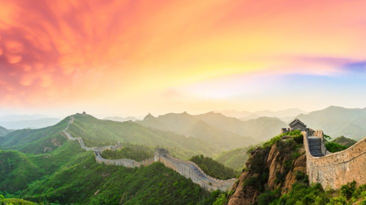 The Great Wall stretching into the distance as the sun sets.