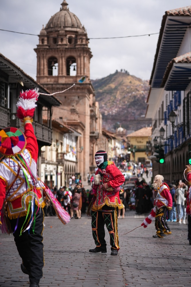 Performers dressed in colourful and traditional Incan costumes parade through the streets of Cusco, Peru